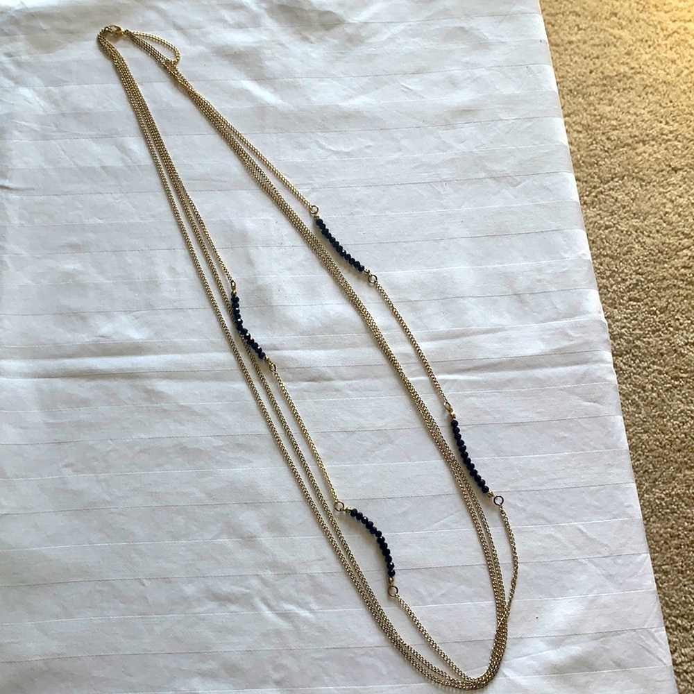 gold necklace with black beads